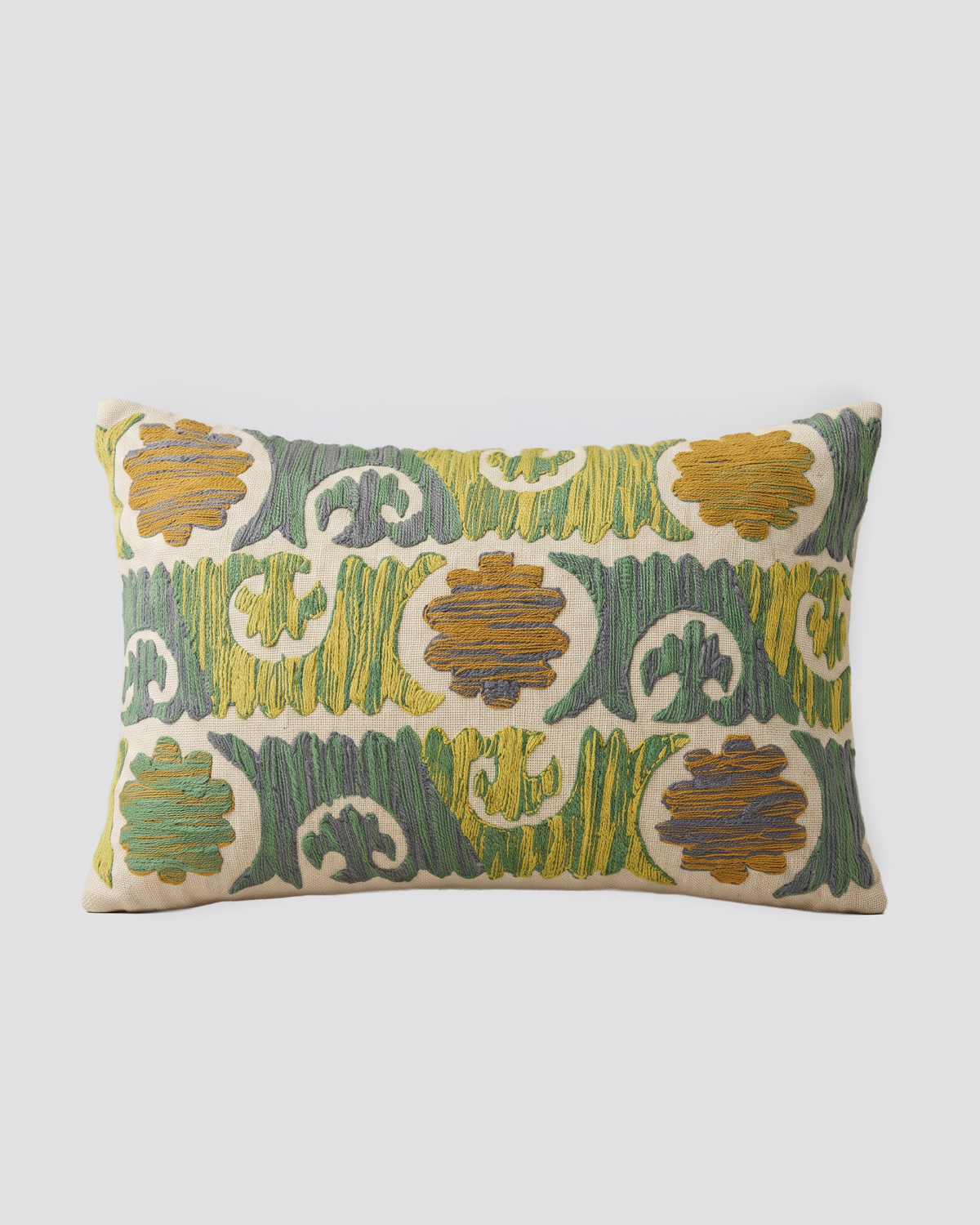 White dori slub pillow cover with a green and mustard floral motif