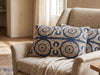 Blue Dori pillow on a cream armchair in a sunlit room