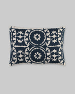 Rectangular pillow cover with navy blue ari-embroidered medallions on ivory