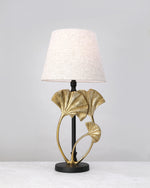 Gilded ginkgo leaf lamp base styled with a linen shade (shade not included)