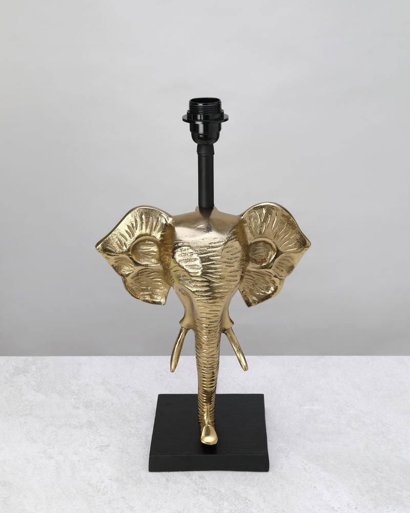 Gilded elephant head table lamp base on a black square stand, shown without a shade