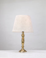 Slender gilded column table lamp with a linen shade