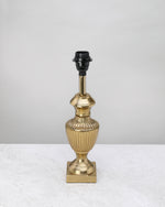 Slim gold reed table lamp base with a fluted urn shape, shown without a shade