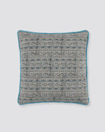 Blue piped cushion cover with a fine grey and blue printed pattern, front view