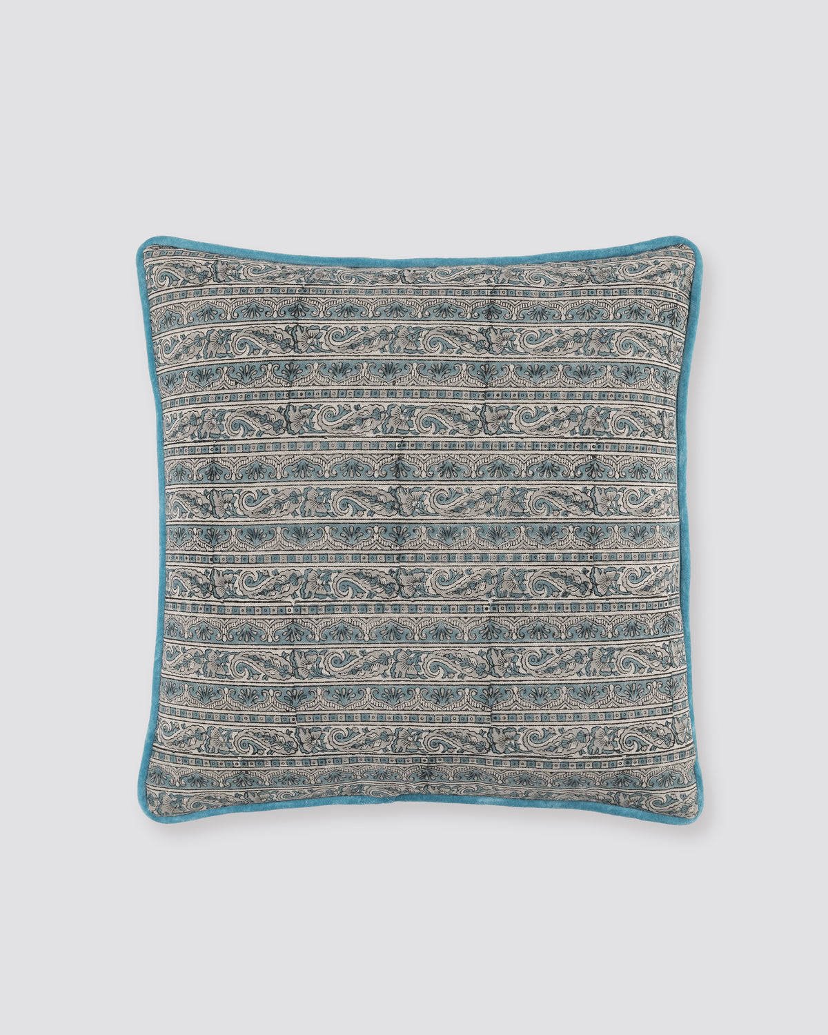 Blue piped cushion cover with a fine grey and blue printed pattern, front view