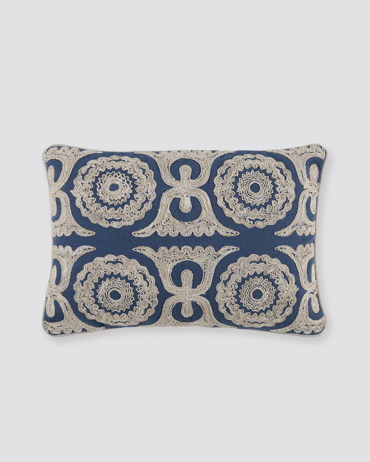 Navy blue rectangular pillow cover with cream Dori cord embroidery, front view