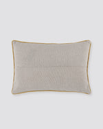 Back of the white floral print pillow cover in plain natural cotton