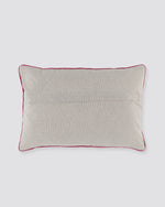 Plain back of the orange bird print pillow cover with piped edge