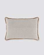 Plain back of the layered dori pillow cover with rust piping