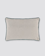Plain beige back of the bird print pillow cover with piped edge