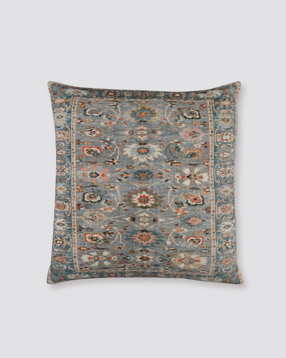 Grey slub cotton cushion cover with a rug-style floral print in grey, rust and cream
