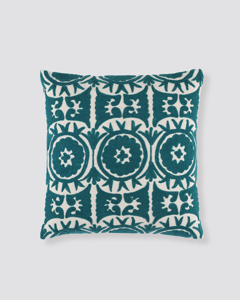 Teal square cushion cover with cream Ari embroidered medallions, front view