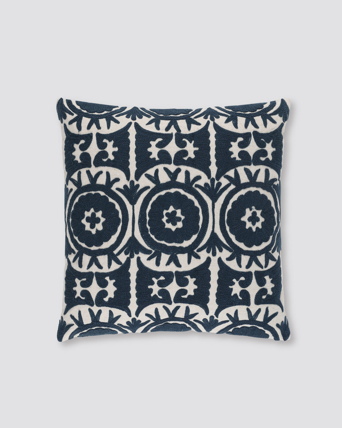 Navy blue square cushion cover with cream Ari embroidered medallions, front view