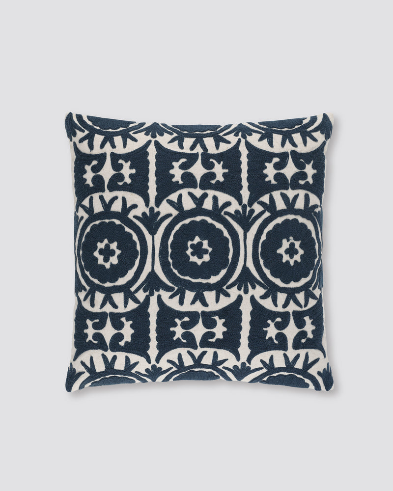 Navy blue square cushion cover with cream Ari embroidered medallions, front view