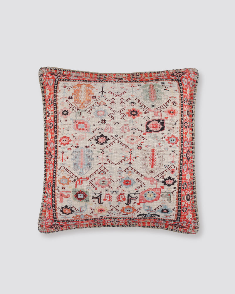 Mosaic slub cotton cushion cover with a pink, red and cream rug-style print