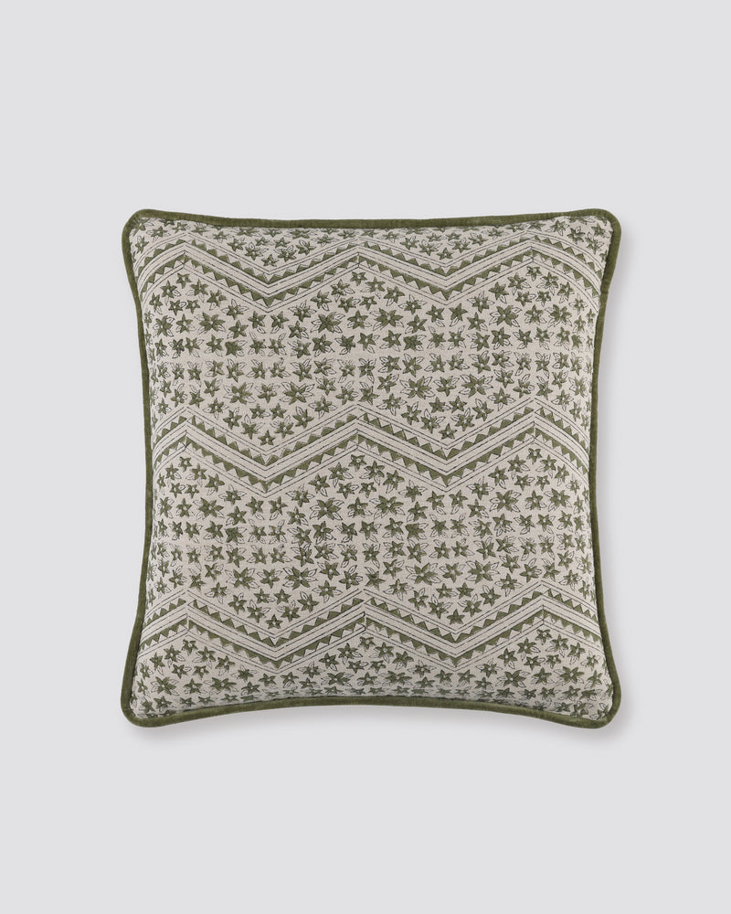 Green piped cushion cover with a zigzag block print on cream and a green piped edge