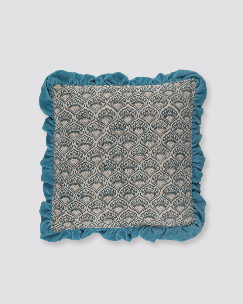 Blue frill cushion cover with a grey scallop print and a blue ruffled edge, front view