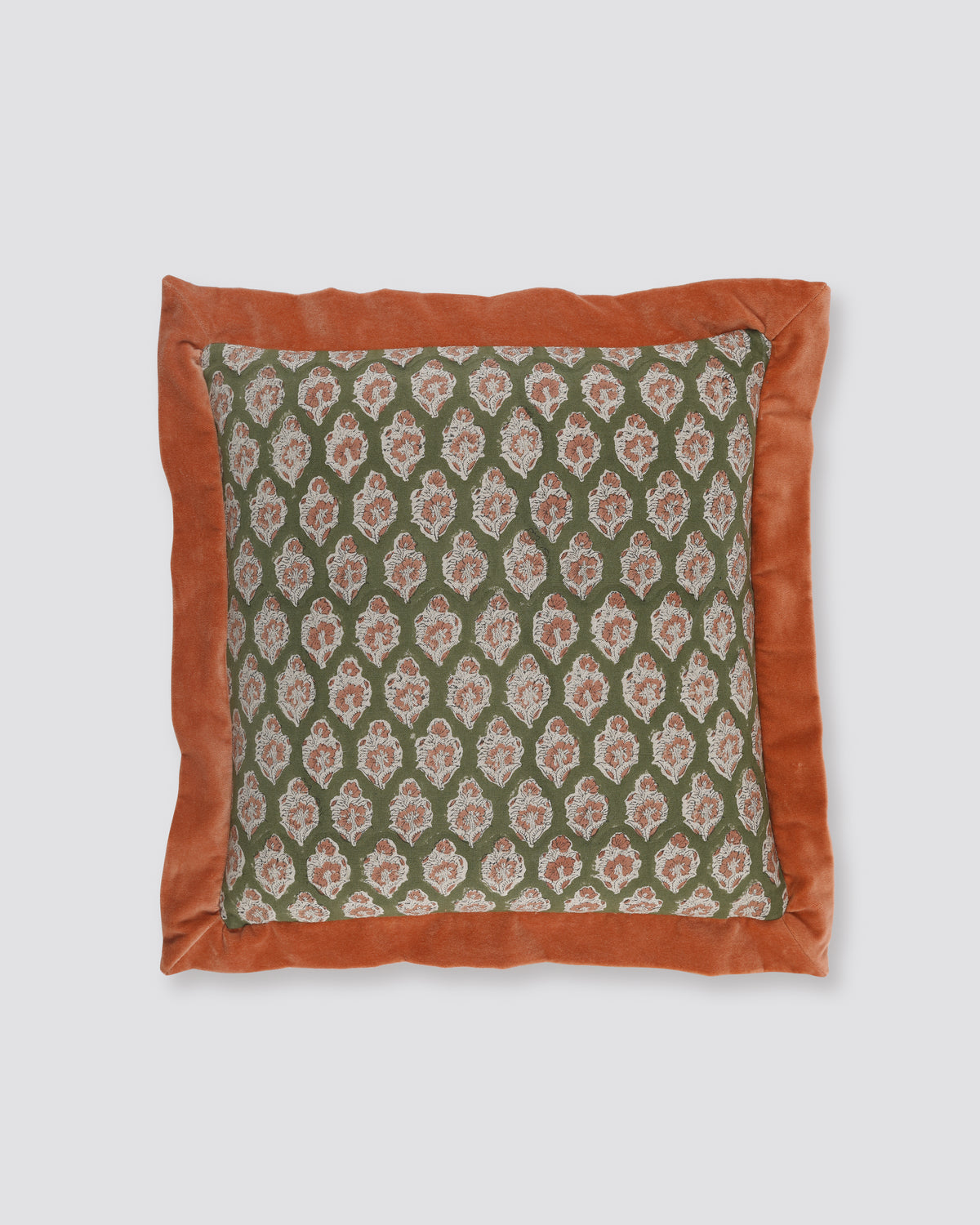 Orange flange cushion cover with a green leaf print on cream and a wide rust border
