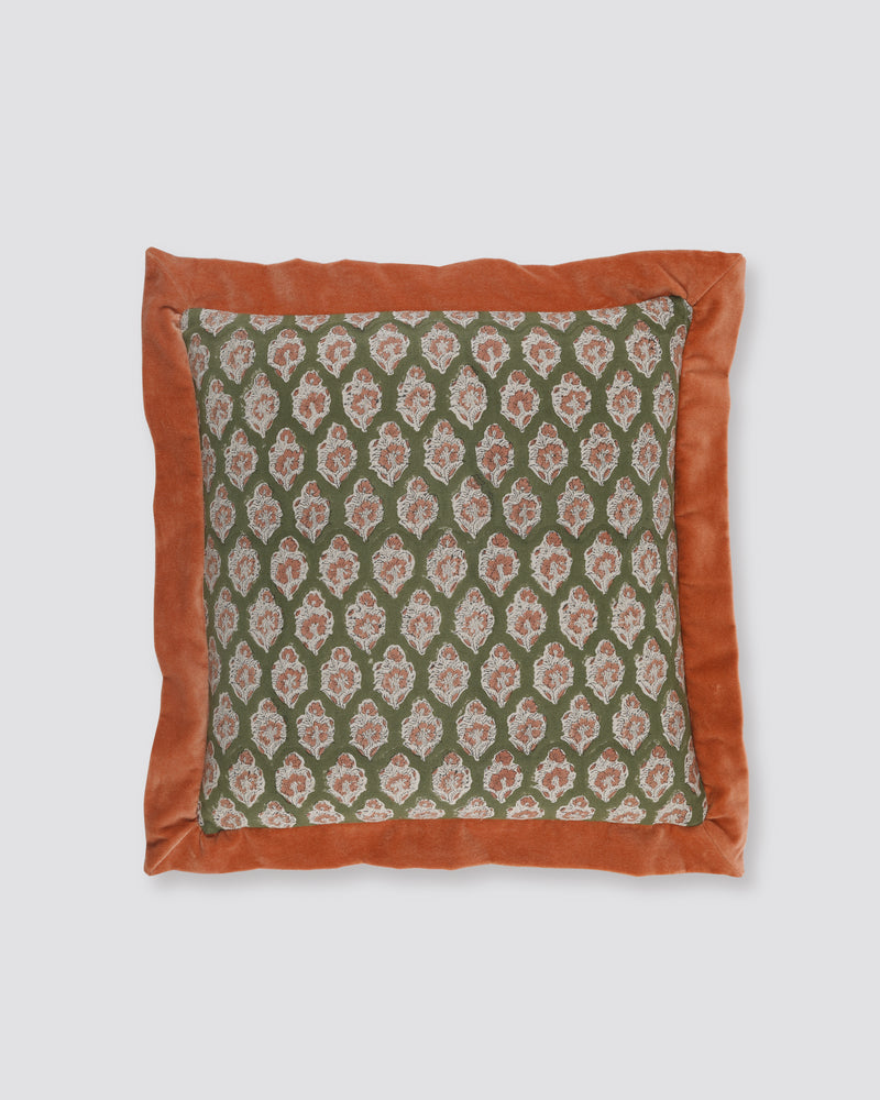 Orange flange cushion cover with a green leaf print on cream and a wide rust border