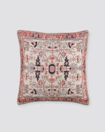 Multicolour slub cotton cushion cover with a pink, red and navy rug-style print