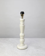 Warm white Bloom lamp base shown without its shade