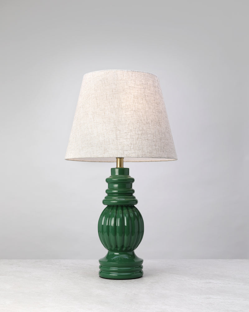 Sage green Hearth mango wood table lamp with a ribbed glossy base and linen shade, on white