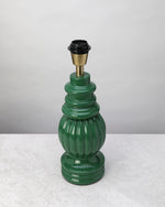 Sage green turned mango wood lamp base shown without its shade