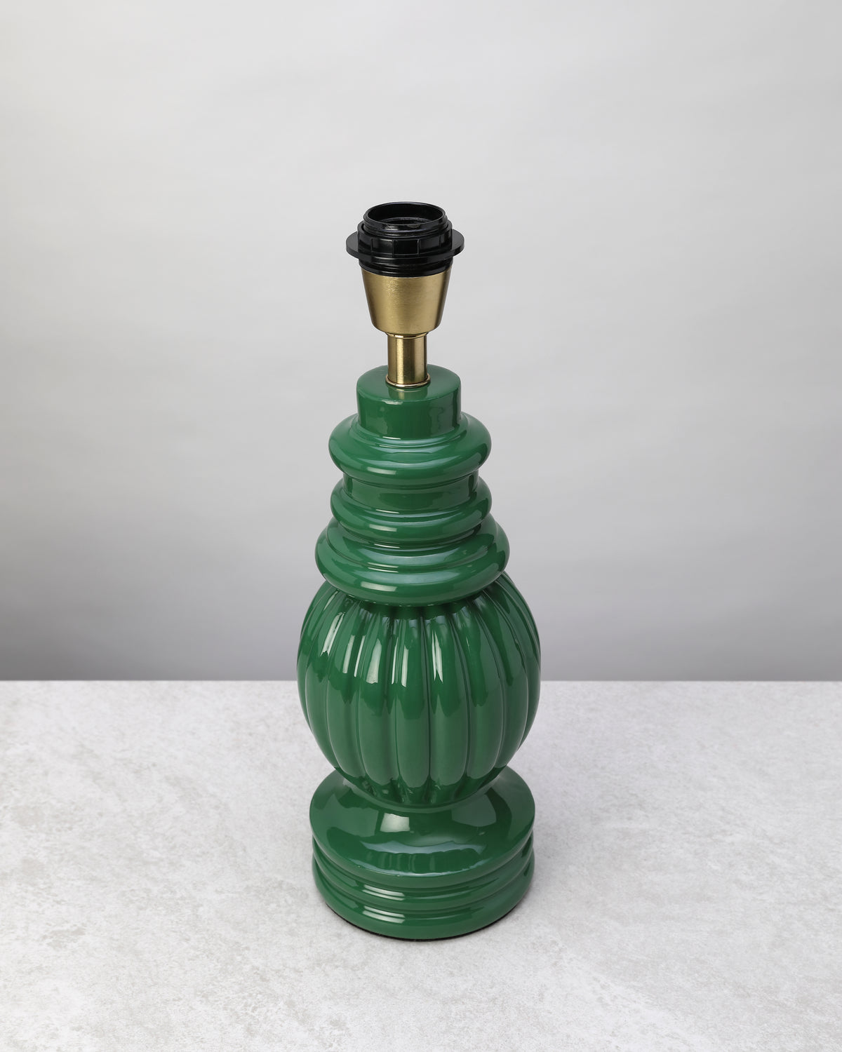Sage green turned mango wood lamp base shown without its shade