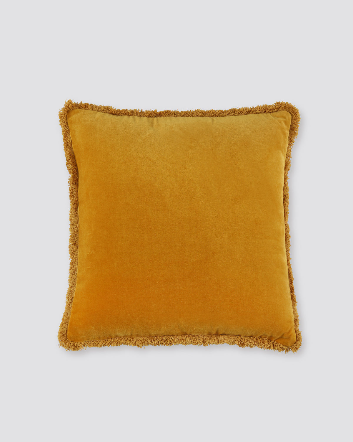 Mustard yellow square velvet cushion cover with a fringed edge, front view