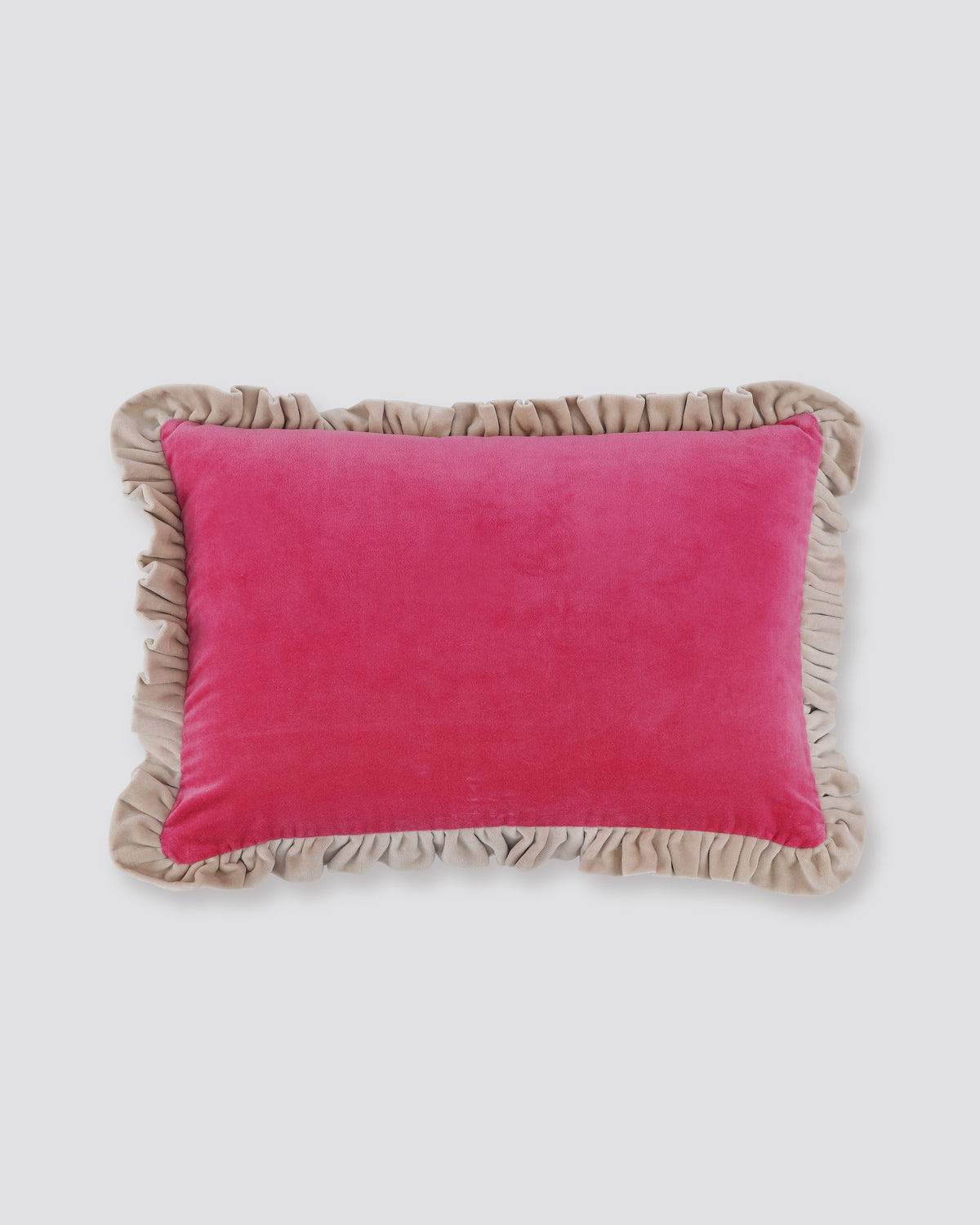 Pink velvet lumbar cushion cover with a contrast frill edge