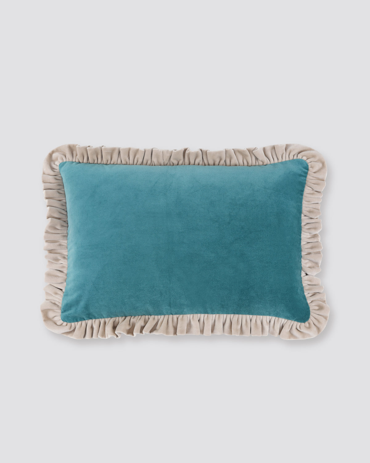 Teal velvet lumbar cushion cover with a contrast frill edge
