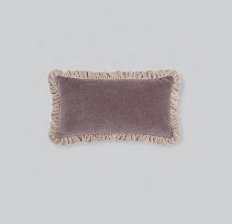 Dusty pink velvet lumbar cushion cover with a contrast cream frill edge, front view