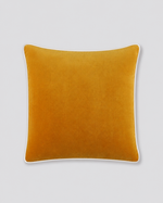 Mustard yellow velvet cushion cover with cream piping, front view