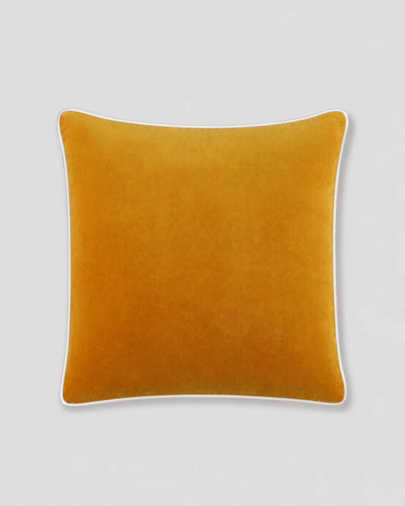 Mustard yellow velvet cushion cover with cream piping, front view