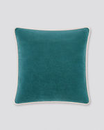 Teal velvet cushion cover with cream piping around the edge, front view