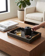 Small olive green slim tray with a teapot and cups on a coffee table