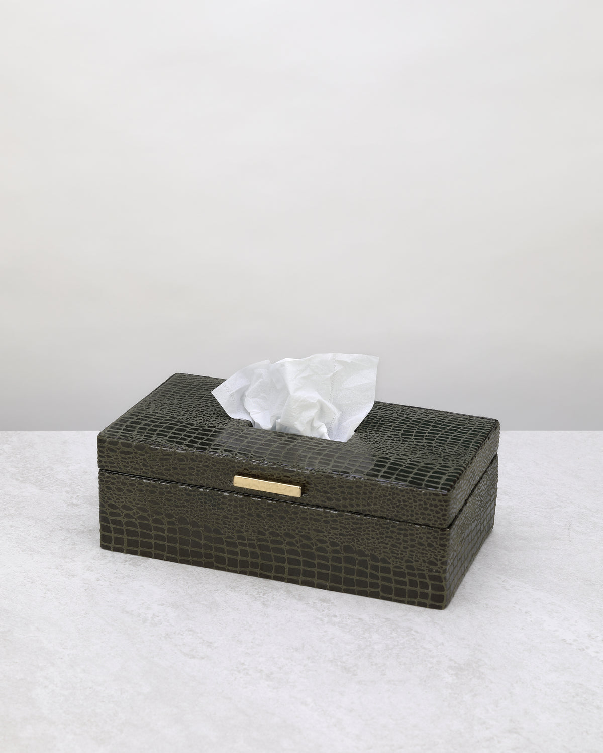 Olive green faux leather tissue box with a gold detail