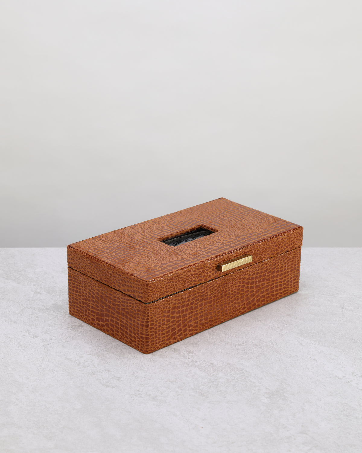Tan faux leather tissue box, angled view