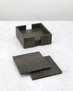 Olive green slim faux leather coasters laid out beside their holder