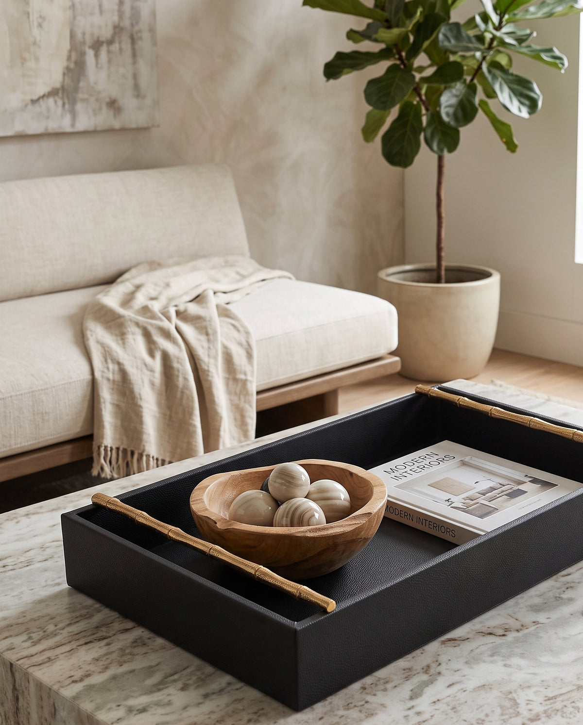 Large cherry faux leather tray holding a wooden bowl on a coffee table