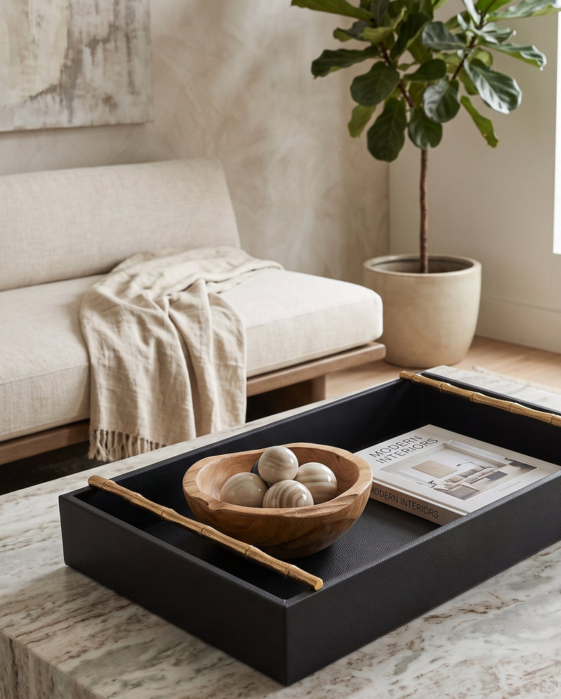 Large cherry faux leather tray holding a wooden bowl on a coffee table