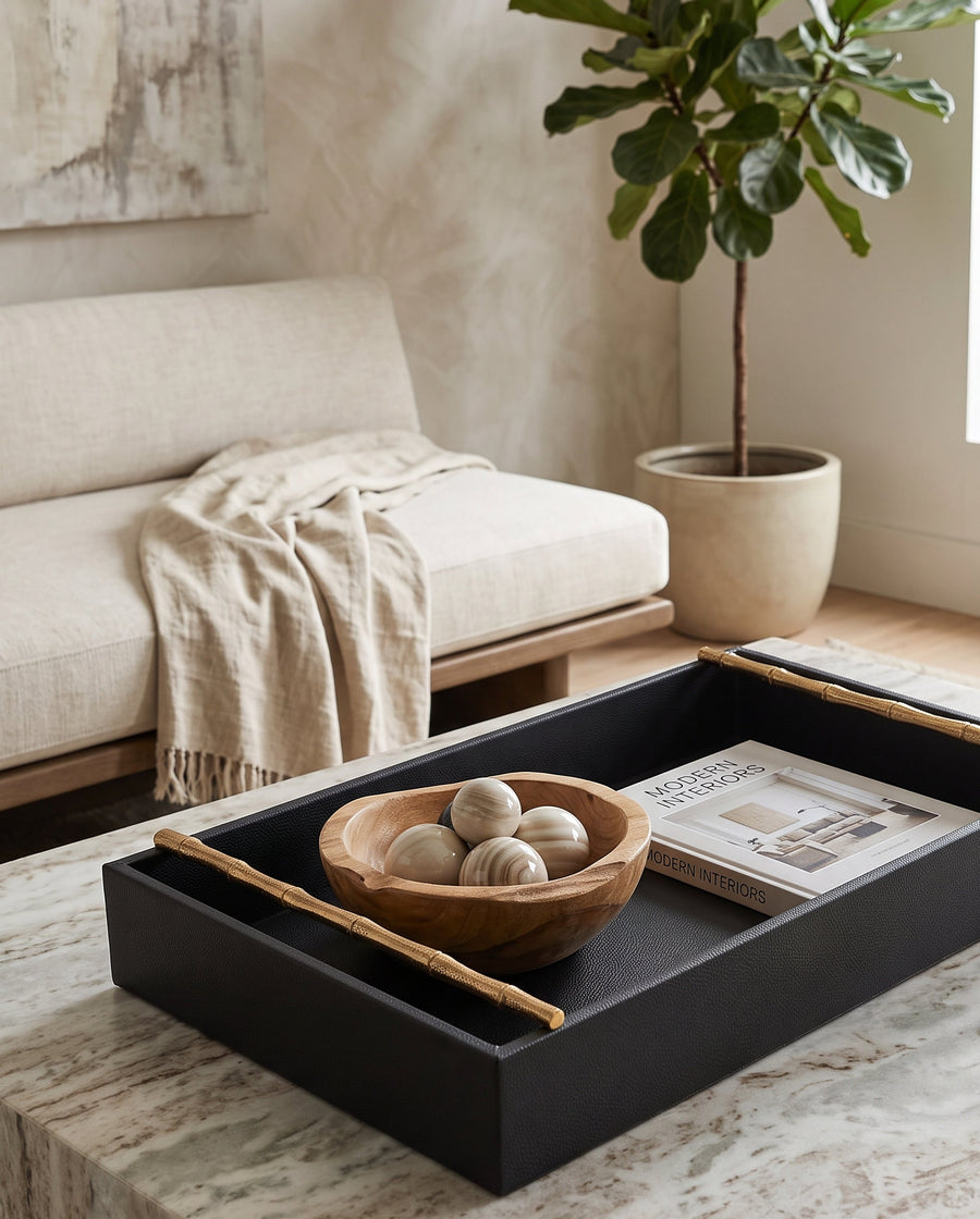 Large cherry faux leather tray holding a wooden bowl on a coffee table