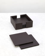 Cherry faux leather coasters laid out beside their holder