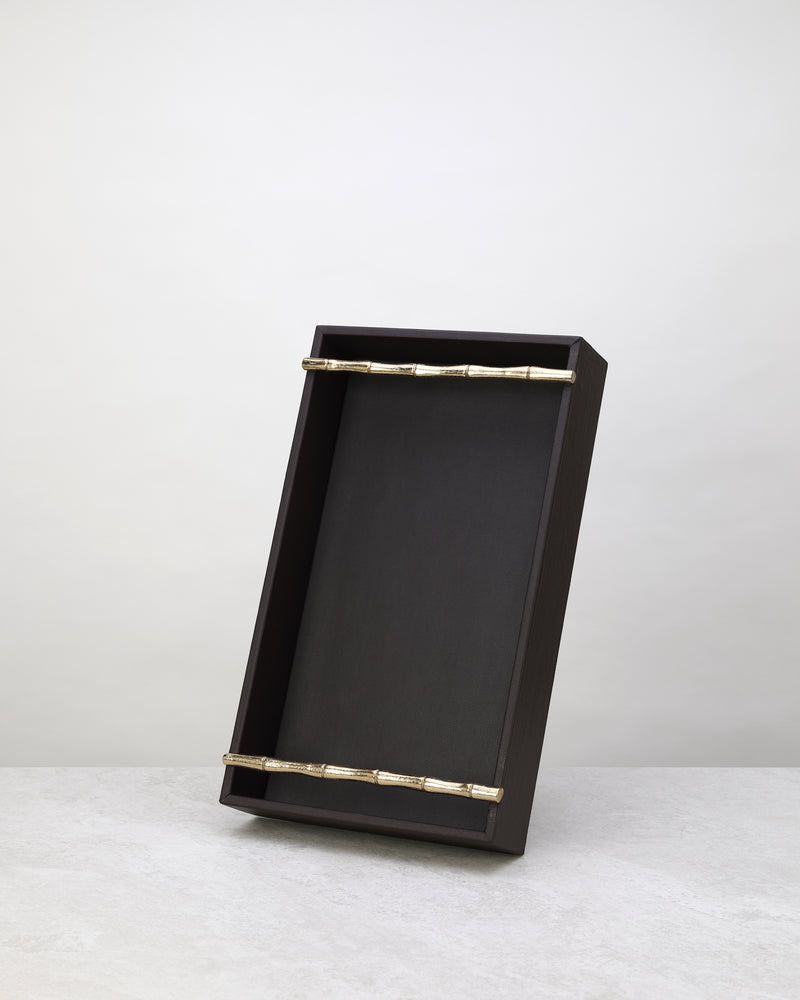Small cherry faux leather tray standing upright to show its brass bar handles