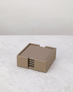 Pea green faux leather coaster set stacked in its holder