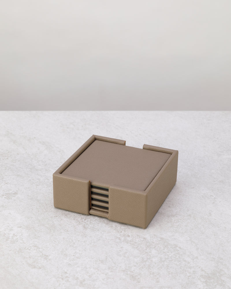 Pea green faux leather coaster set stacked in its holder