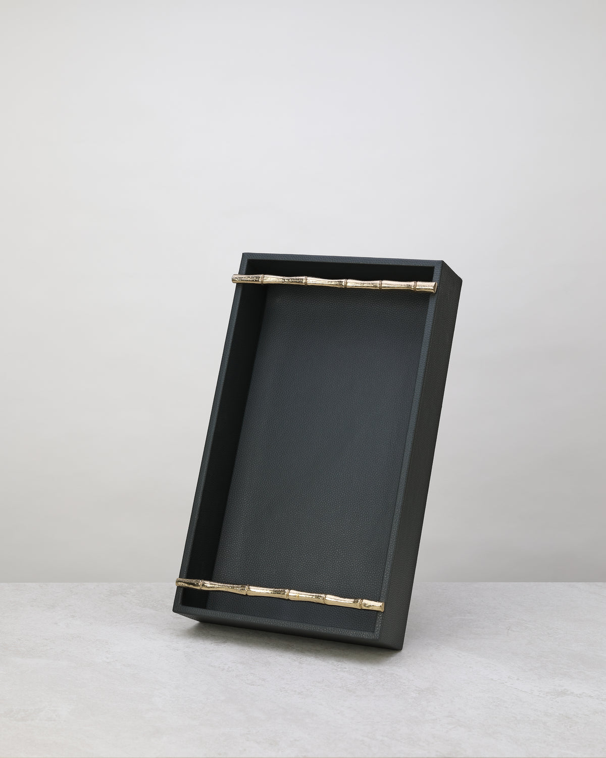 Small olive green faux leather tray standing upright
