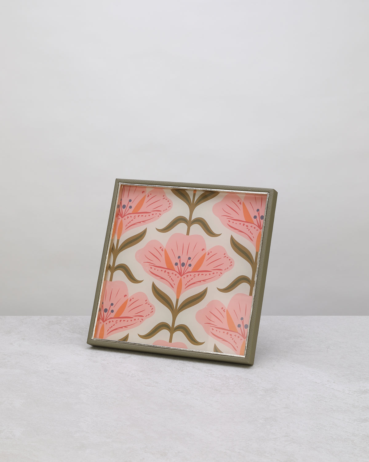 Square tray with a pink floral print and green frame