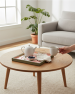 Green floral square tray with a teapot on a round coffee table