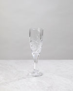 Single clear machine cut champagne flute, front view
